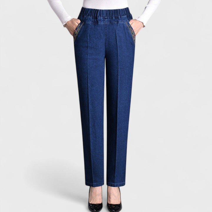 Black women's relaxed fit stretch jeans. Features comfortable elastic waist & functional side pockets.