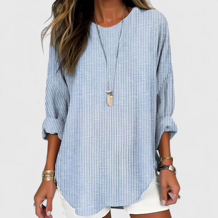 Stylish women's striped blouse, a comfortable top for versatile all-season fashion. Relaxed fit for effortless everyday wear.