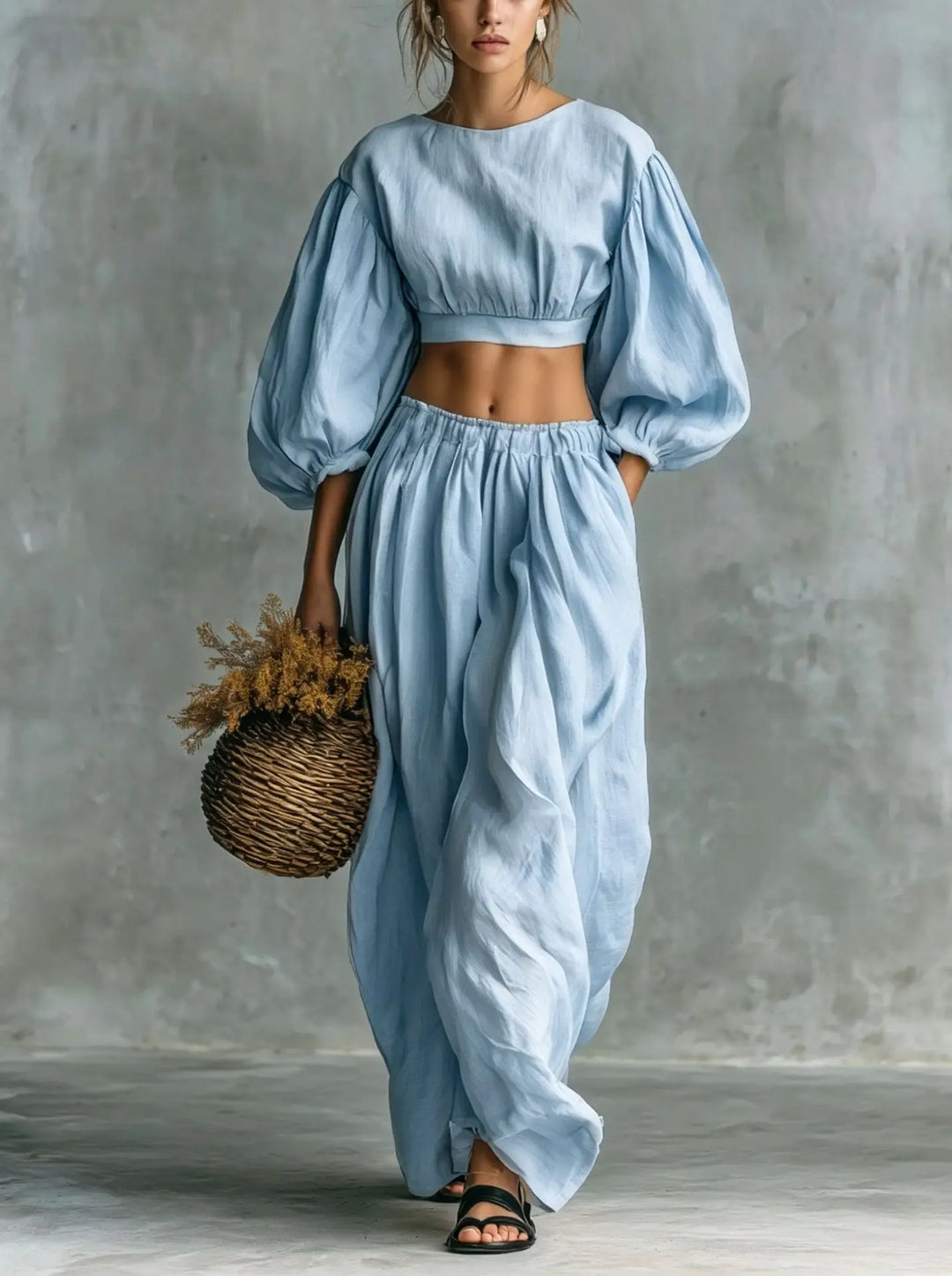 Women's comfortable two-piece trouser set with balloon sleeve cropped top & wide-leg pants for casual vacation wear.