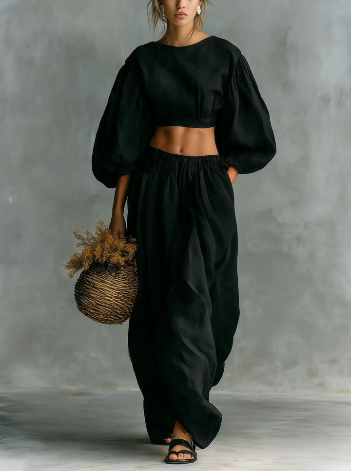 Stylish women's matching two-piece set featuring a balloon sleeve top & wide-leg trousers, perfect for casual wear.