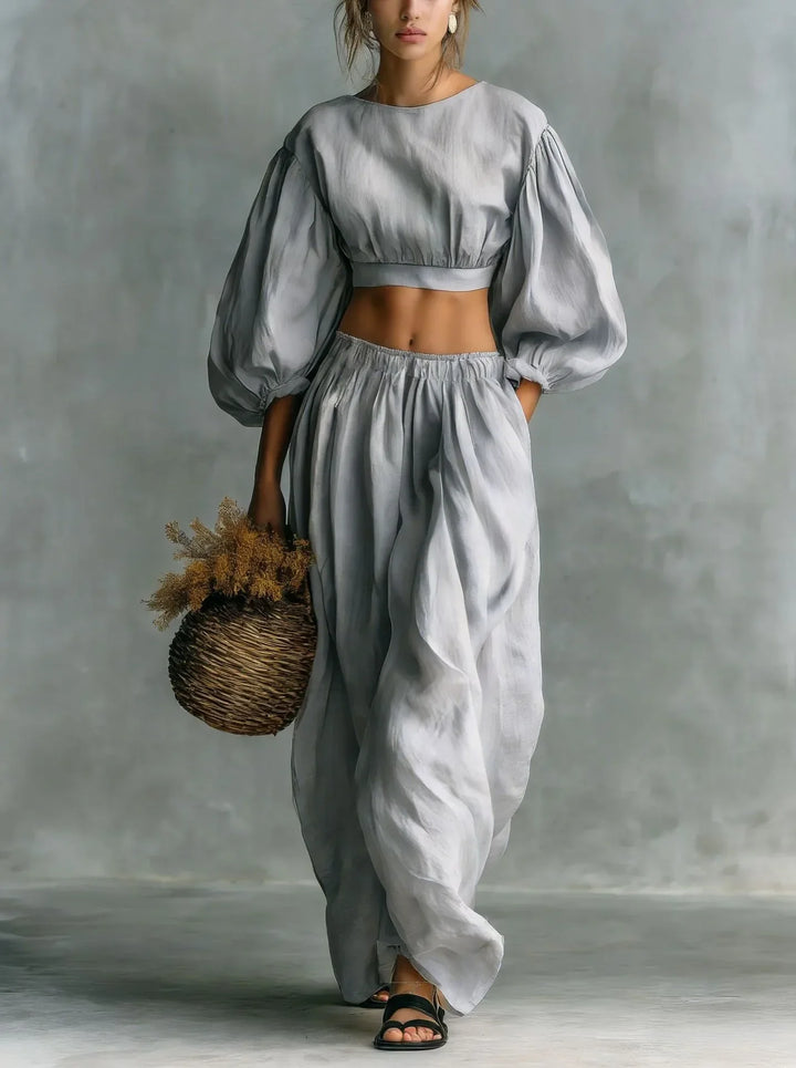 Modern women's balloon sleeve cropped top and wide-leg trouser set, a chic and comfortable two-piece outfit.