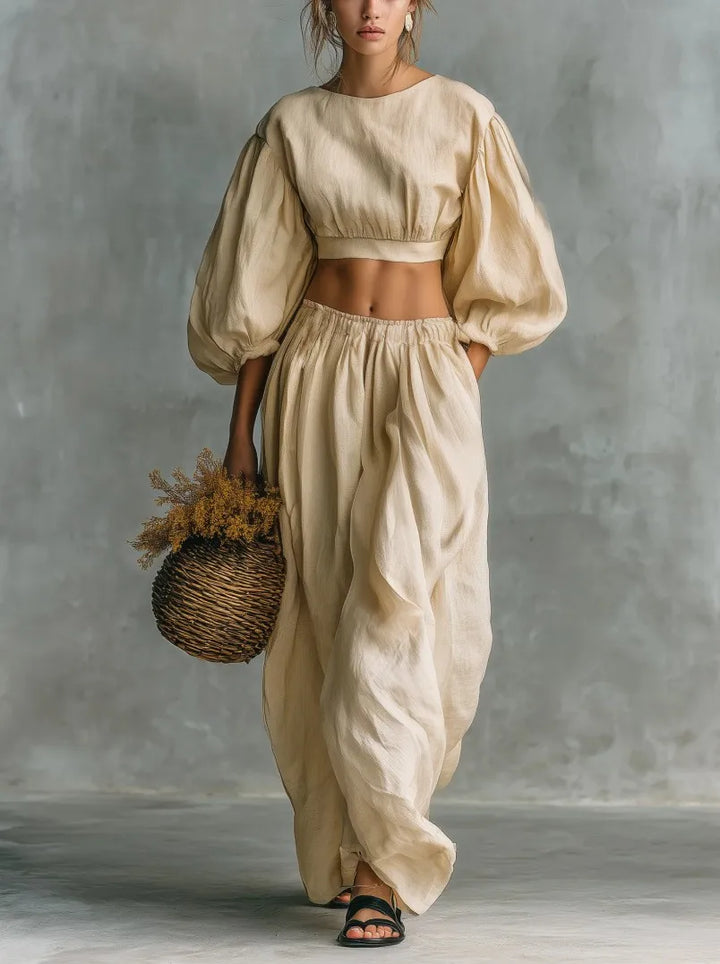 Fashionable women's two-piece balloon sleeve trouser set with wide-leg pants, ideal for casual and vacation outfits.