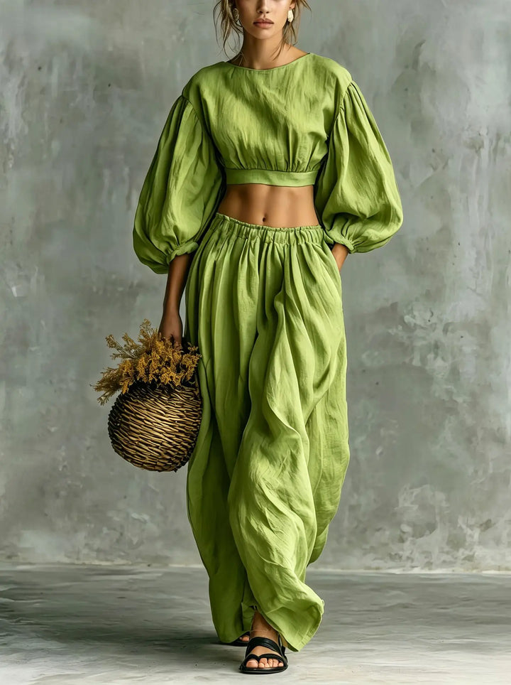 Women's comfortable two-piece outfit: cropped top with balloon sleeves & matching wide-leg trousers for fashion.