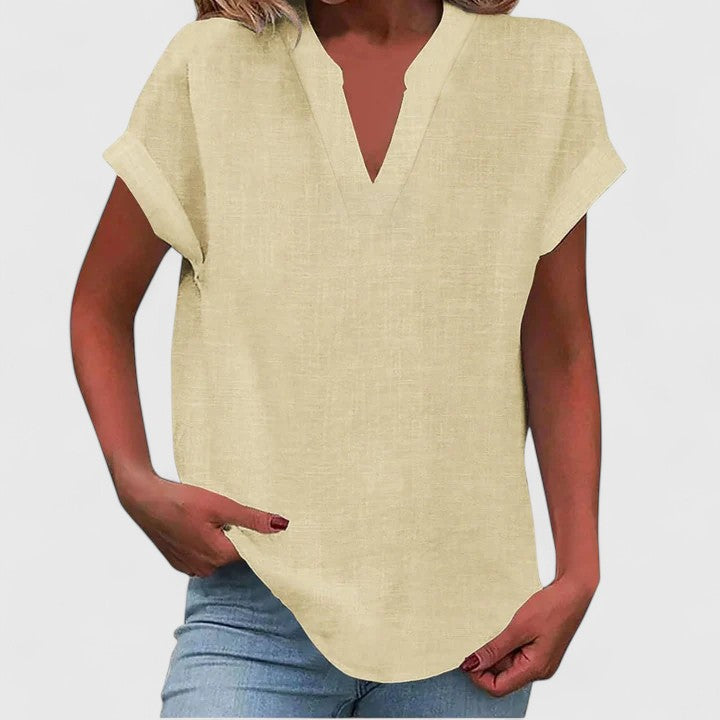 Stylish women's V-neck blouse with a comfortable, relaxed fit, perfect for summer fashion.