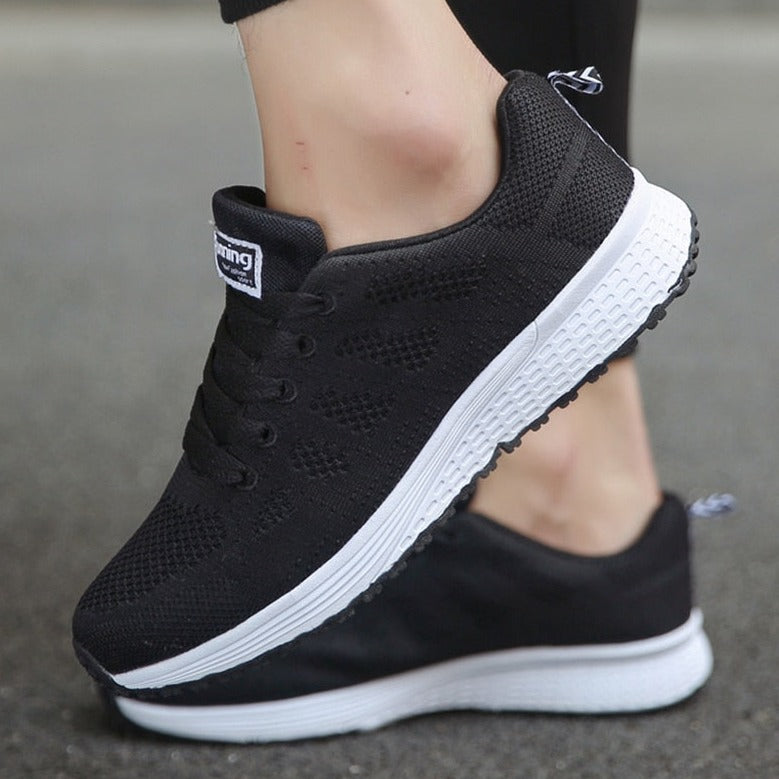Lightweight women's athletic shoes with orthopedic arch support & a breathable design.