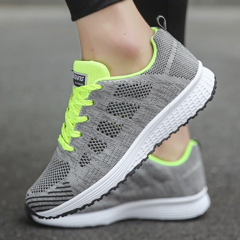 Side view of women's orthopedic walking sneakers, highlighting responsive sole & arch support.