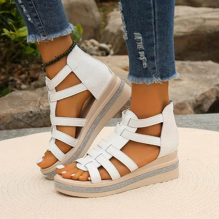 Comfortable women's wedge sandals featuring a cushioned sole, perfect elevated footwear for casual summer days.