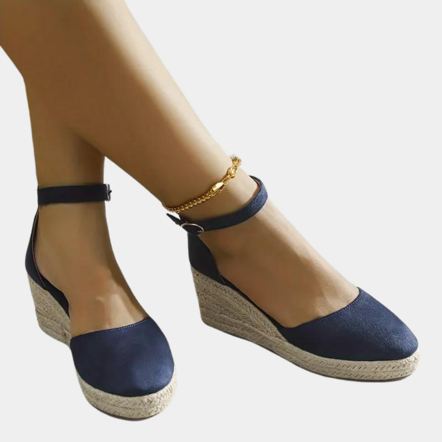 Fashionable & comfortable women's wedge sandals with adjustable ankle strap, perfect for summer.