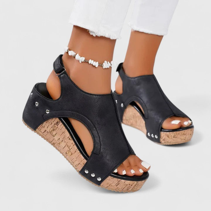 Fashionable ladies' wedge sandals offering arch support & comfort. Stylish summer footwear for a chic yet supportive look.