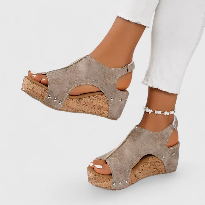 Elegant women's wedge sandals featuring arch support for supreme comfort. Versatile summer footwear for casual to dressy.