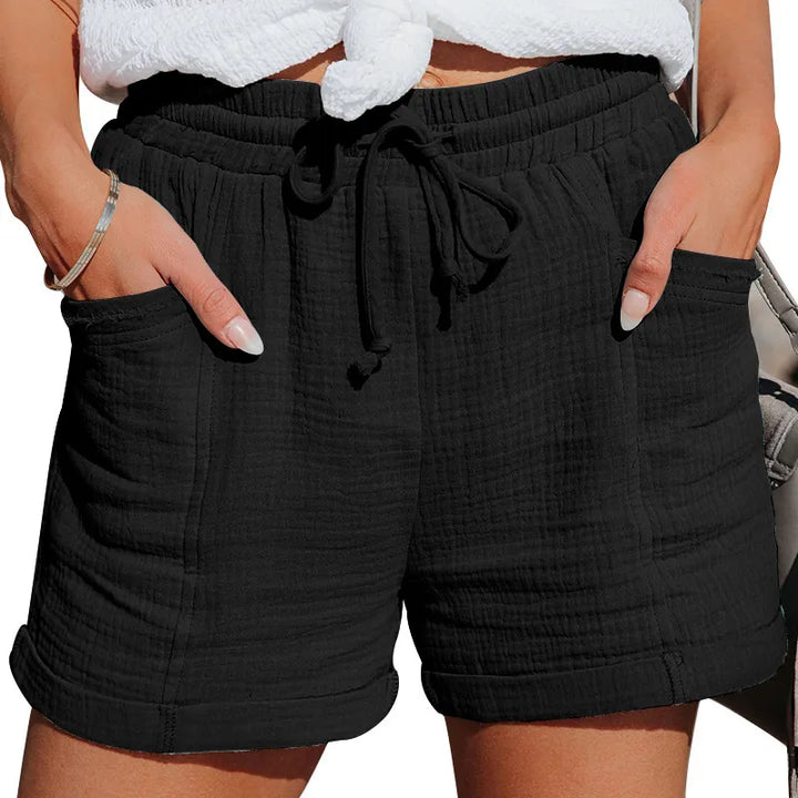 Casual women's summer shorts with elastic drawstring waist and practical pockets for everyday comfort.
