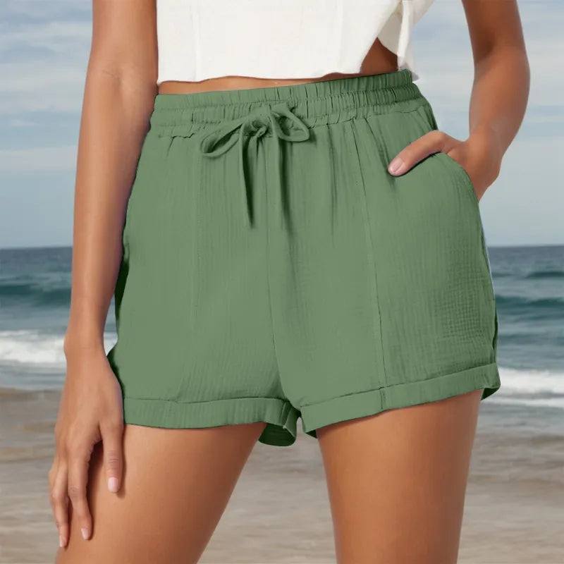 Comfy women's drawstring shorts, ideal for warm weather, featuring practical pockets and relaxed fit.