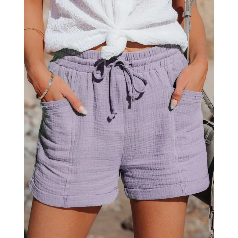 Versatile women's casual shorts with a comfy drawstring waist and pockets, perfect for summer activities.