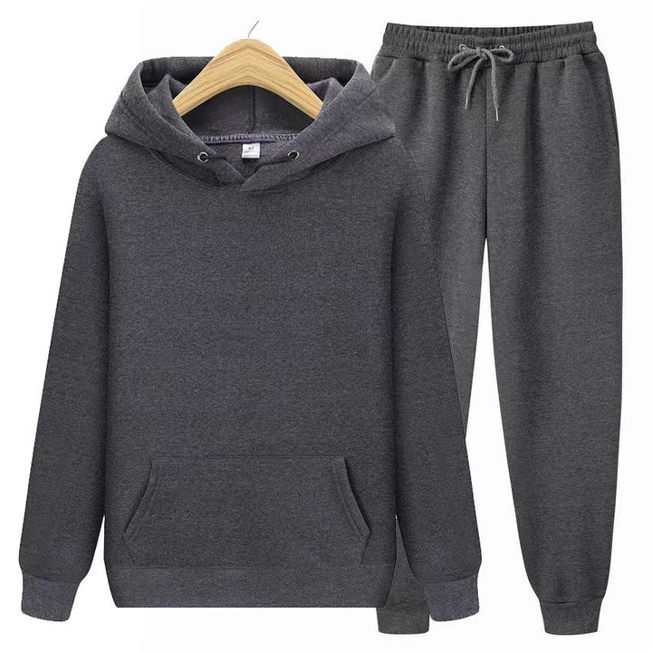 Side view: Woman in comfy hooded sweatshirt & jogger set, highlighting the relaxed, flattering silhouette.
