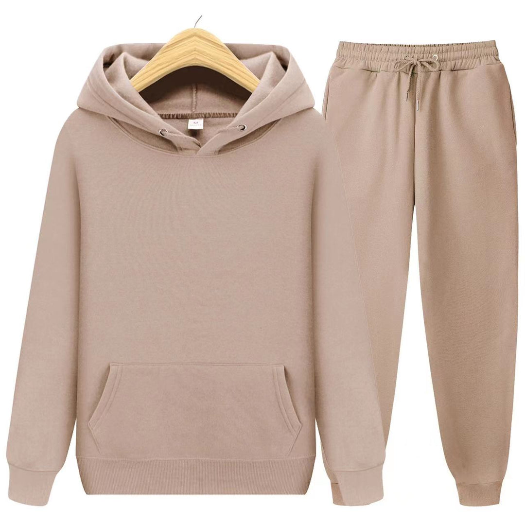 Woman wearing a relaxed fit hooded sweatshirt & jogger set. Perfect for home, travel, or casual errands.