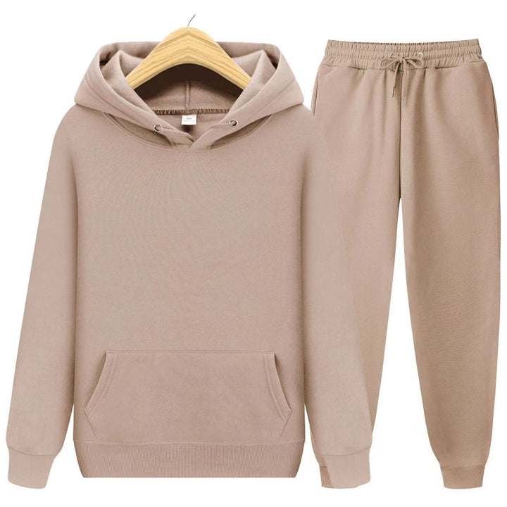 Woman wearing a relaxed fit hooded sweatshirt & jogger set. Perfect for home, travel, or casual errands.