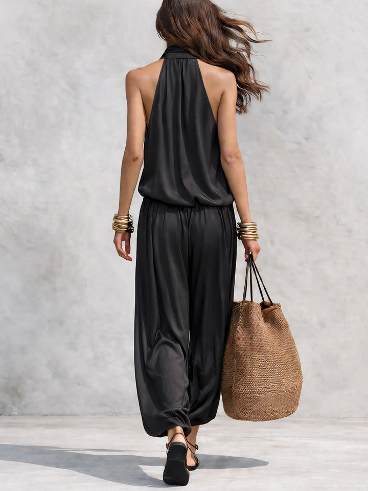 Elegant women's two-piece set featuring a cowl neck halter top and stylish wide leg pants for parties.
