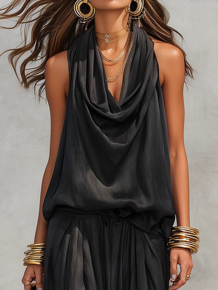 Chic women's halter top with cowl neck & flowing wide leg pants. A fashionable two-piece summer outfit.