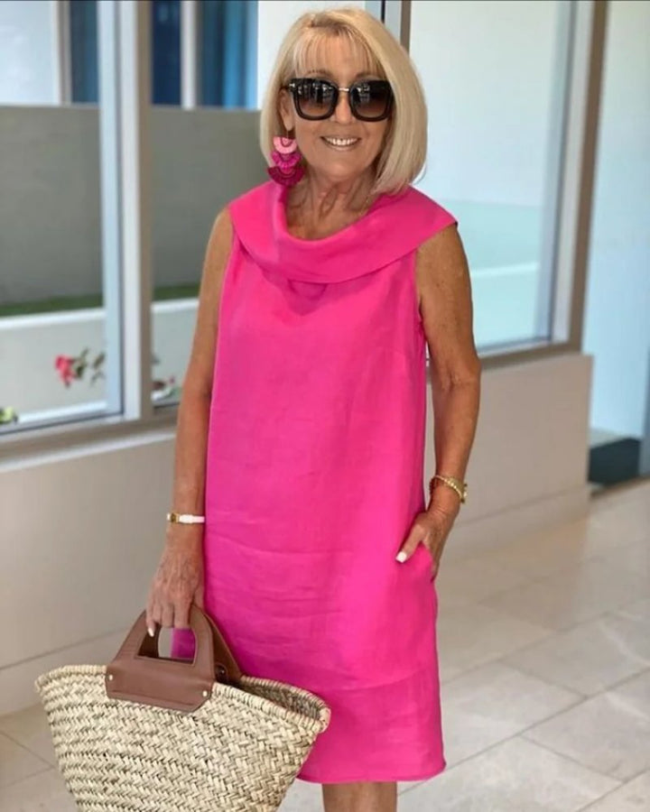 Women's cowl neck shift dress with pockets, a sleeveless, relaxed fit for casual summer wear. Comfortable & flowy.