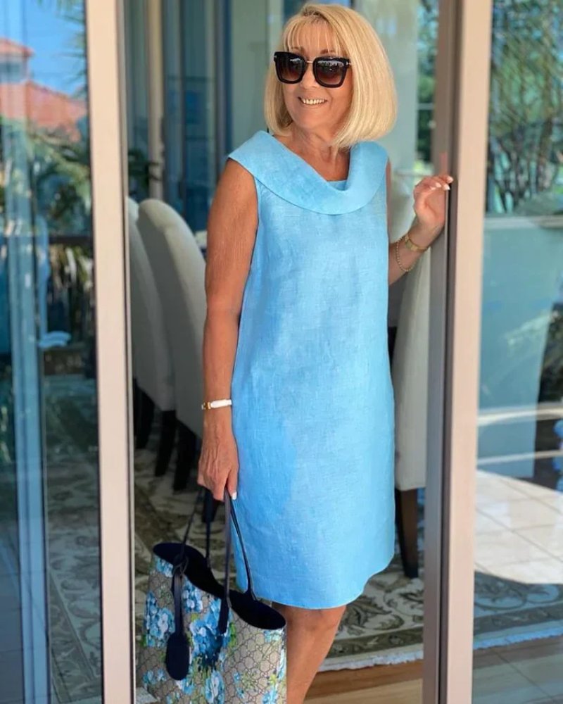 Stylish women's sleeveless cowl neck shift dress. Relaxed fit, perfect for summer, vacation, or brunch outfits. With pockets.