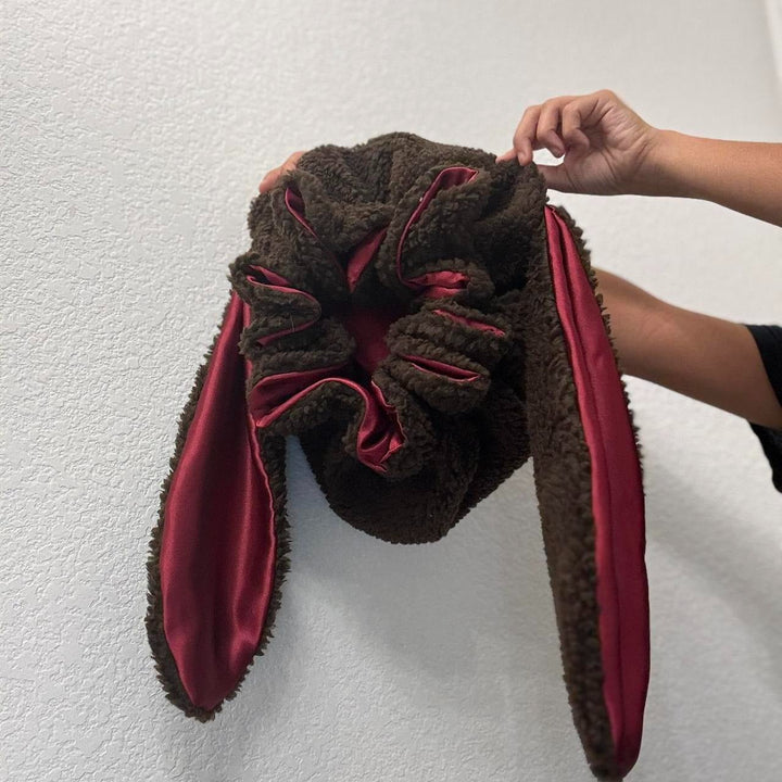 Charming women's winter hat, a soft bunny bonnet providing warmth and cute, cozy style.