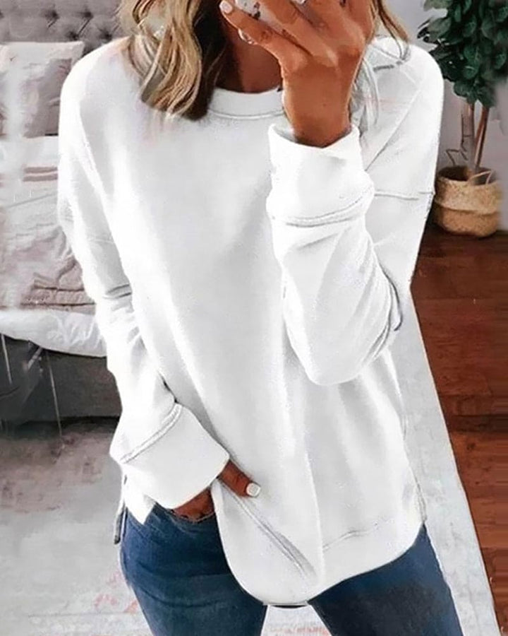 Soft women's long-sleeve crewneck sweatshirt, relaxed fit for ultimate cozy comfort & versatile casual wear.