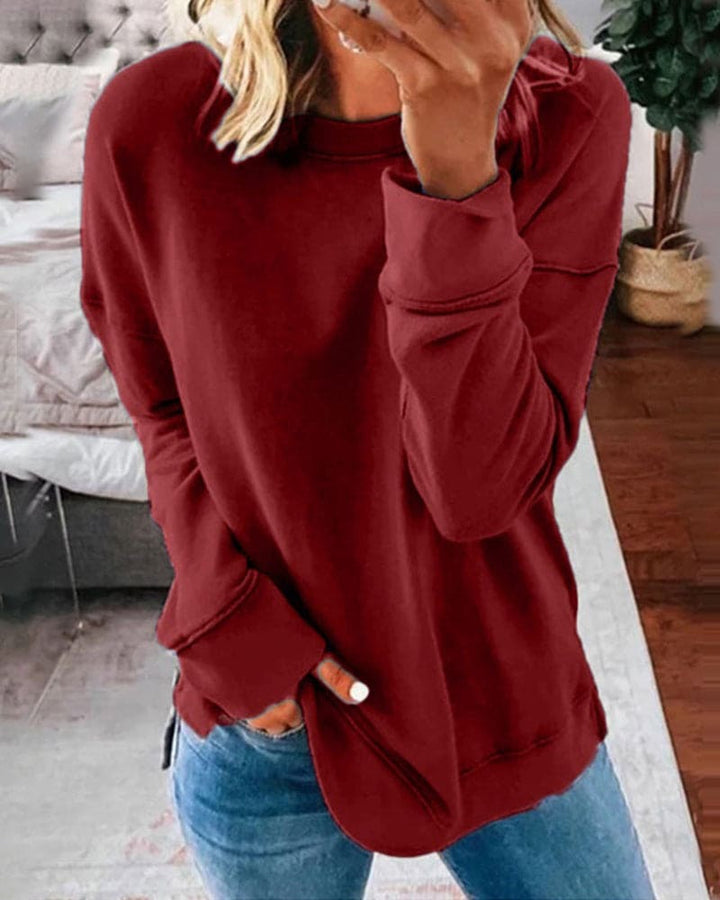 Relaxed fit women's long-sleeve crewneck sweatshirt, soft & cozy for casual wear & ultimate everyday comfort.