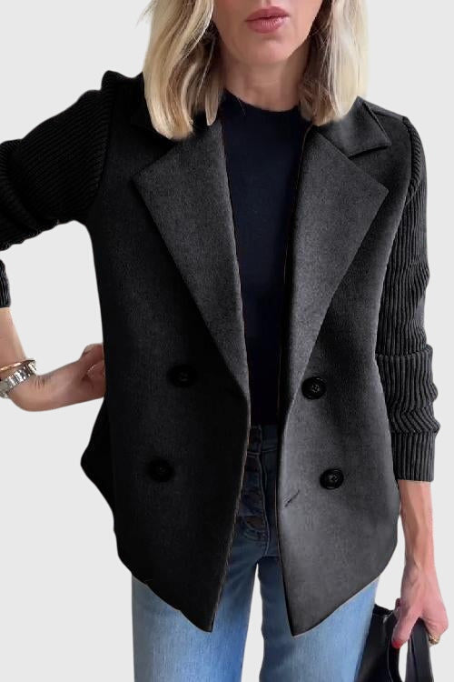 Fashionable women's double-breasted outerwear. Cozy blazer with eye-catching contrast sleeves for modern style.