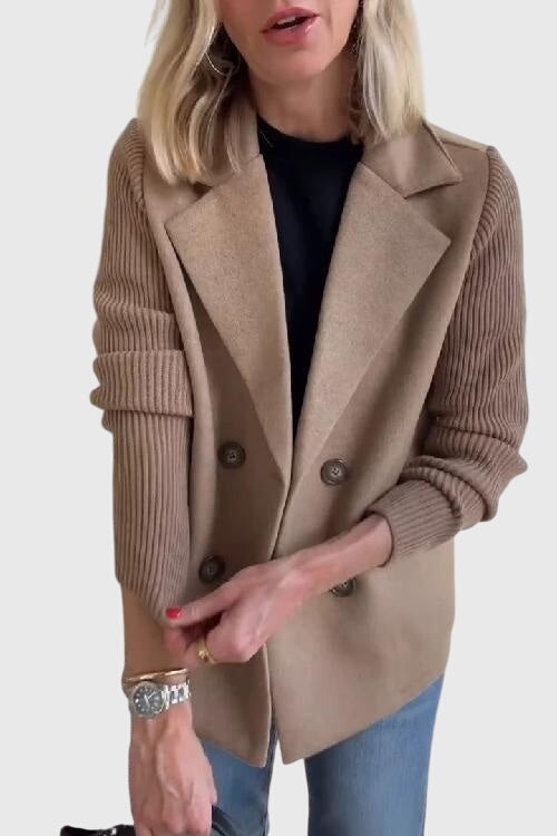 Elegant women's double-breasted blazer featuring cozy fabric and fashionable contrast sleeve details. Chic outerwear.