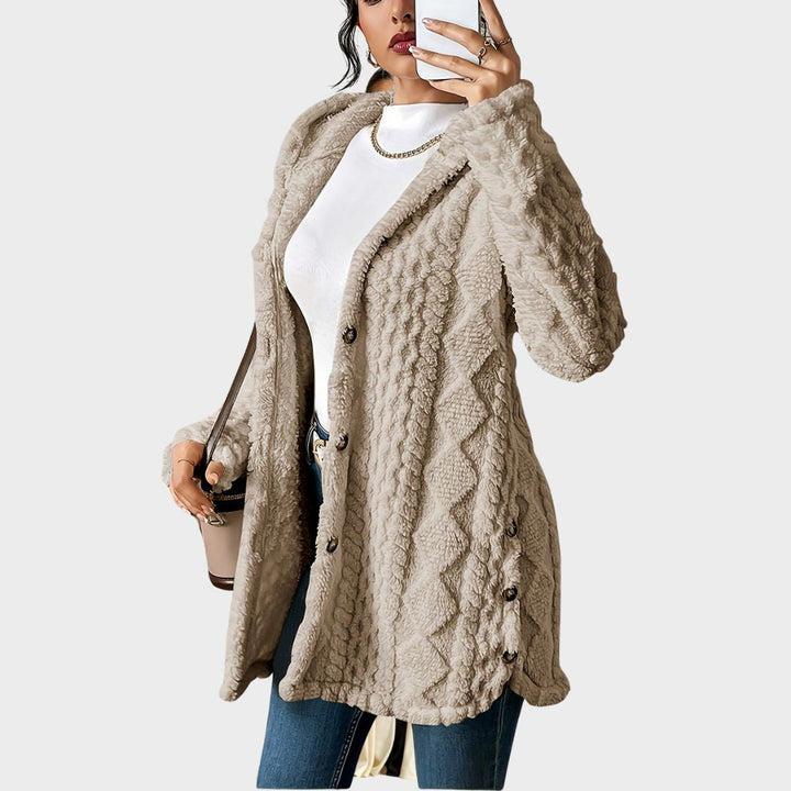 Chic women's hooded long coat with button front. Textured outerwear for effortless everyday style.