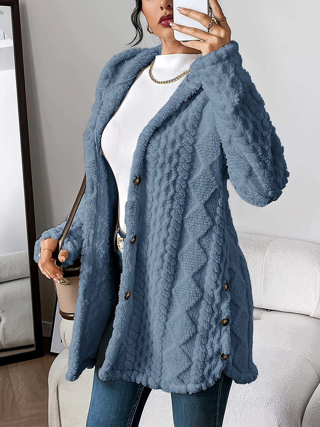 Casual women's button-front hooded jacket. Warm, relaxed fit outerwear for fall and winter fashion.