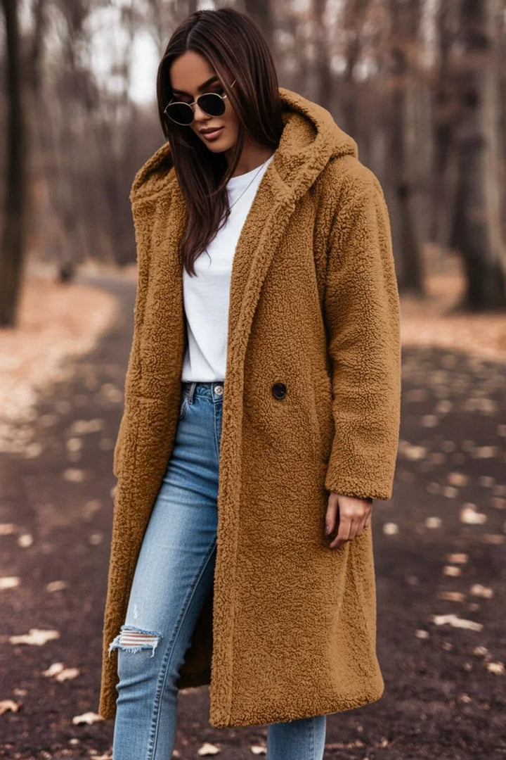 Fashionable women's oversized teddy coat with hood, offering ultimate winter warmth.