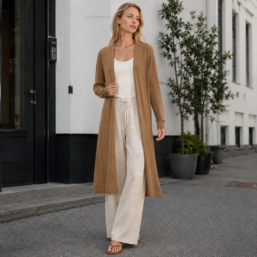 Close-up of the soft, chunky knit texture of a women's cozy long cardigan. Perfect for comfort.