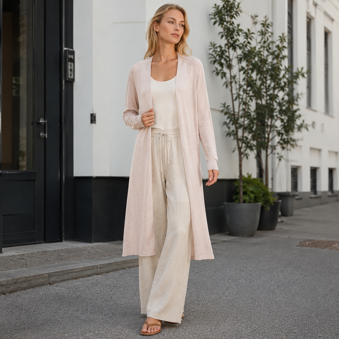 Side profile of a women's cozy long knit cardigan, great for fall layering & warm style.