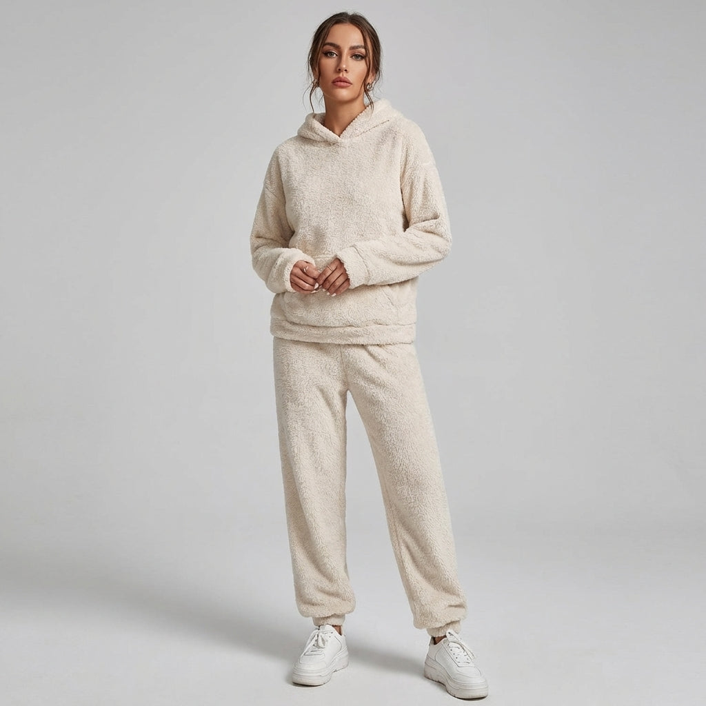 Women's cozy plush loungewear set with hooded top and pants, perfect for comfortable relaxation and casual wear.