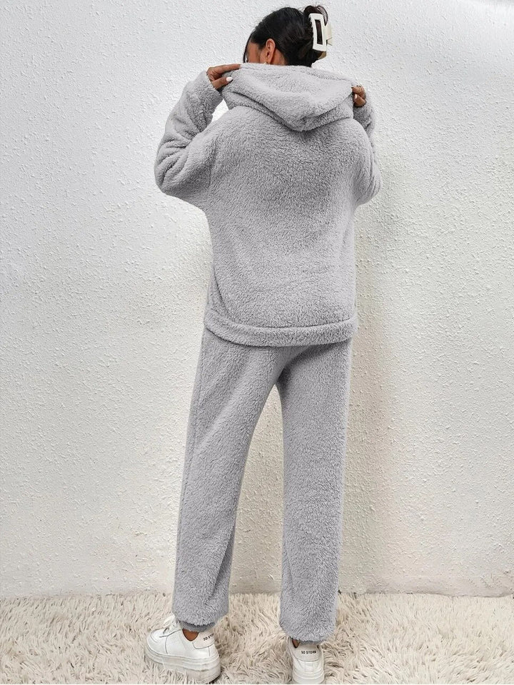 Women's matching two-piece plush loungewear set, featuring a cozy hooded top and soft pants.