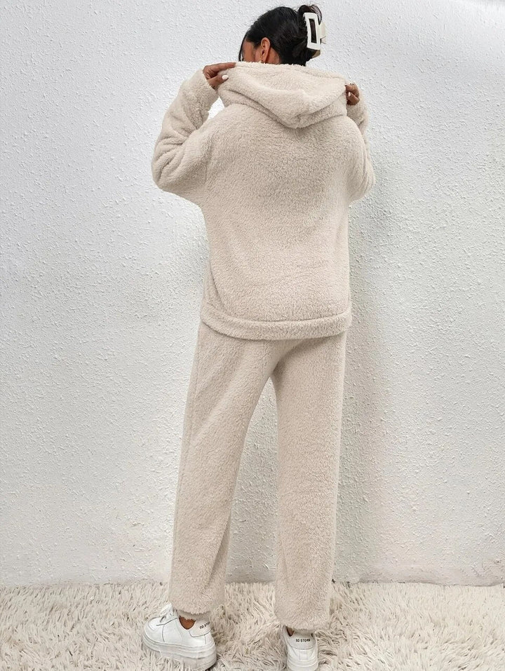 Folded new women's matching plush loungewear set, a soft and cozy winter essential outfit.