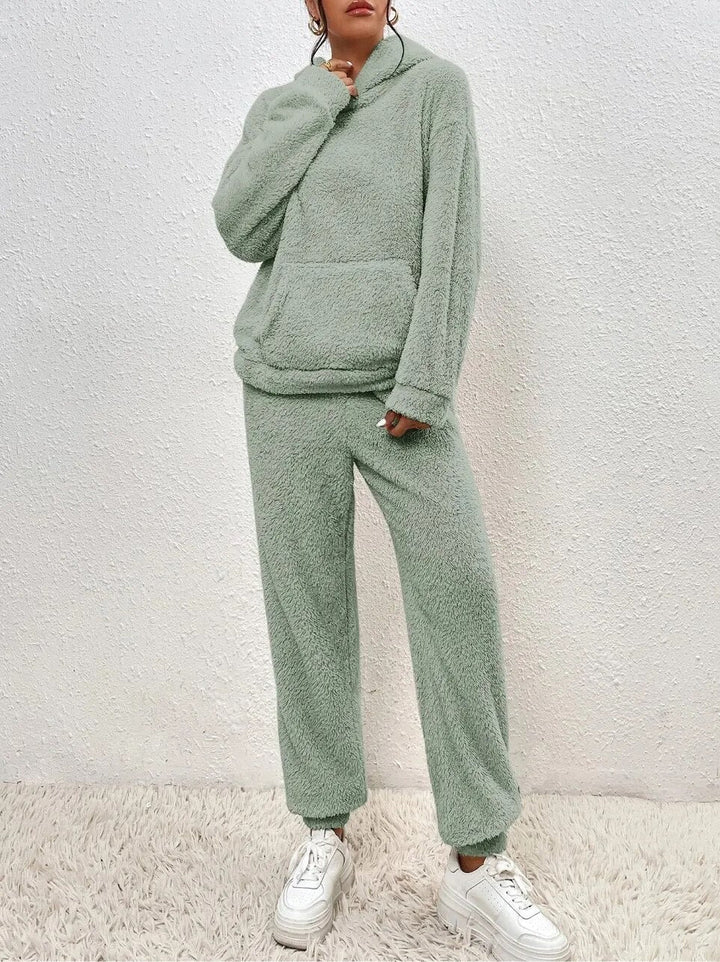 Happy model in a soft, warm women's plush loungewear set, perfect for cozy winter evenings & casual wear.
