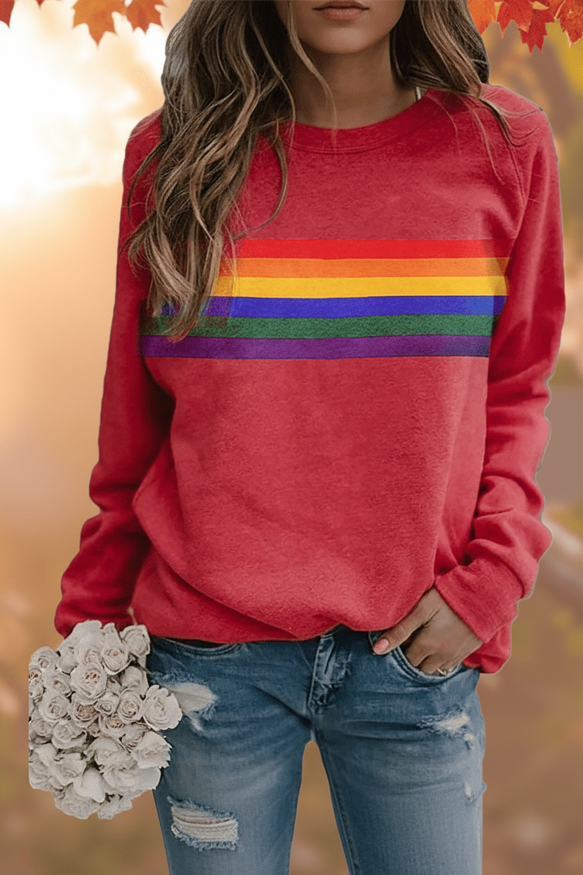 Women's cozy rainbow striped sweatshirt for everyday comfort. Long-sleeve pullover with retro style.