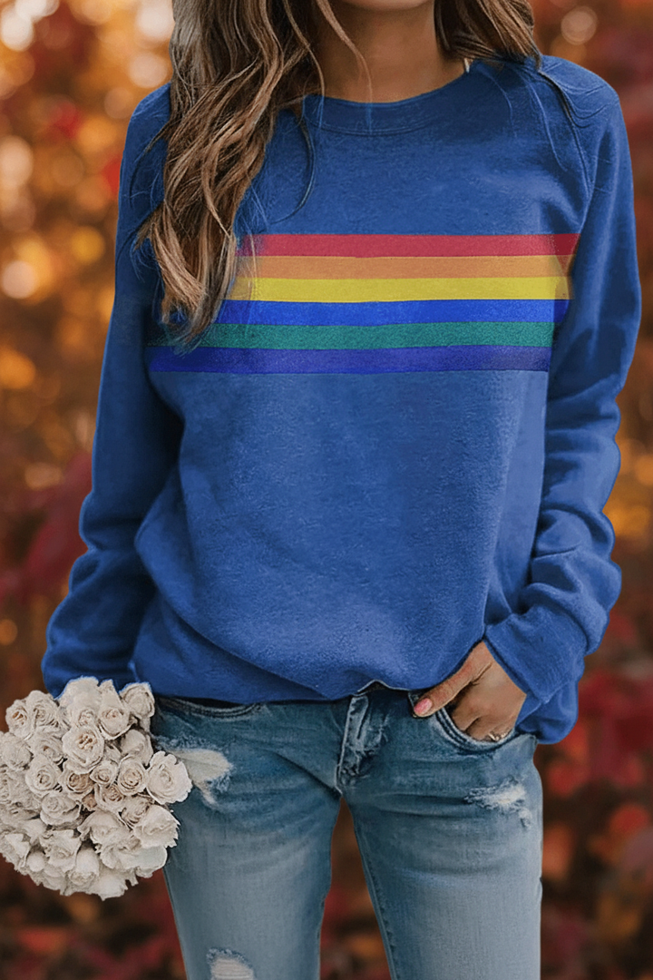 Vibrant rainbow striped women's sweatshirt with a cozy, comfortable fit. Retro long-sleeve pullover.