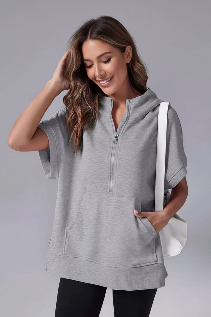 Effortless women's short sleeve half-zip hoodie, perfect for casual wear or lounging in comfort.
