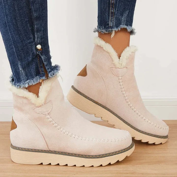 Women's cozy slip-on winter ankle boots, perfect for warm, comfortable everyday wear in cold weather.