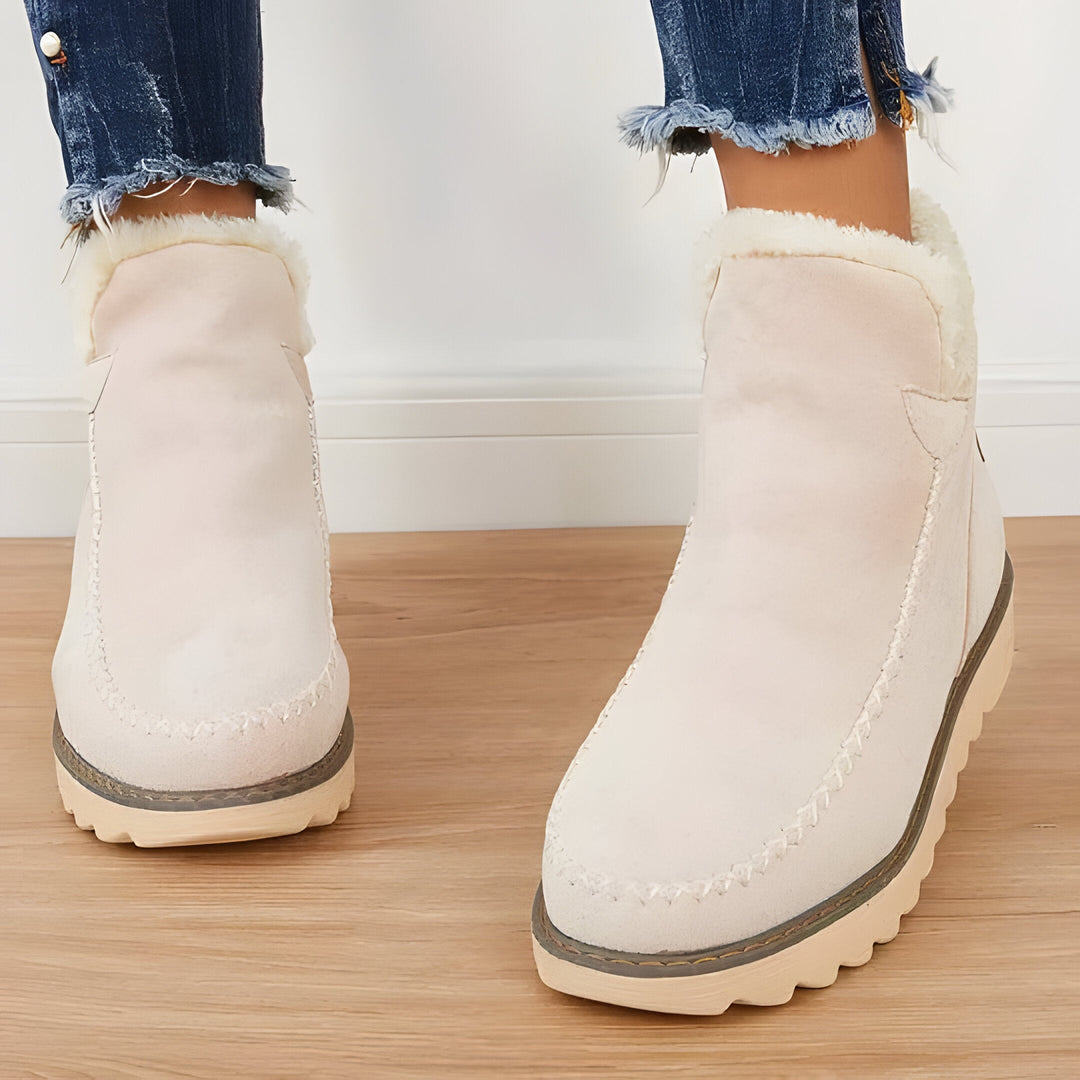 Stylish women's slip-on ankle boots, perfect for casual outdoor activities & comfortable everyday wear.