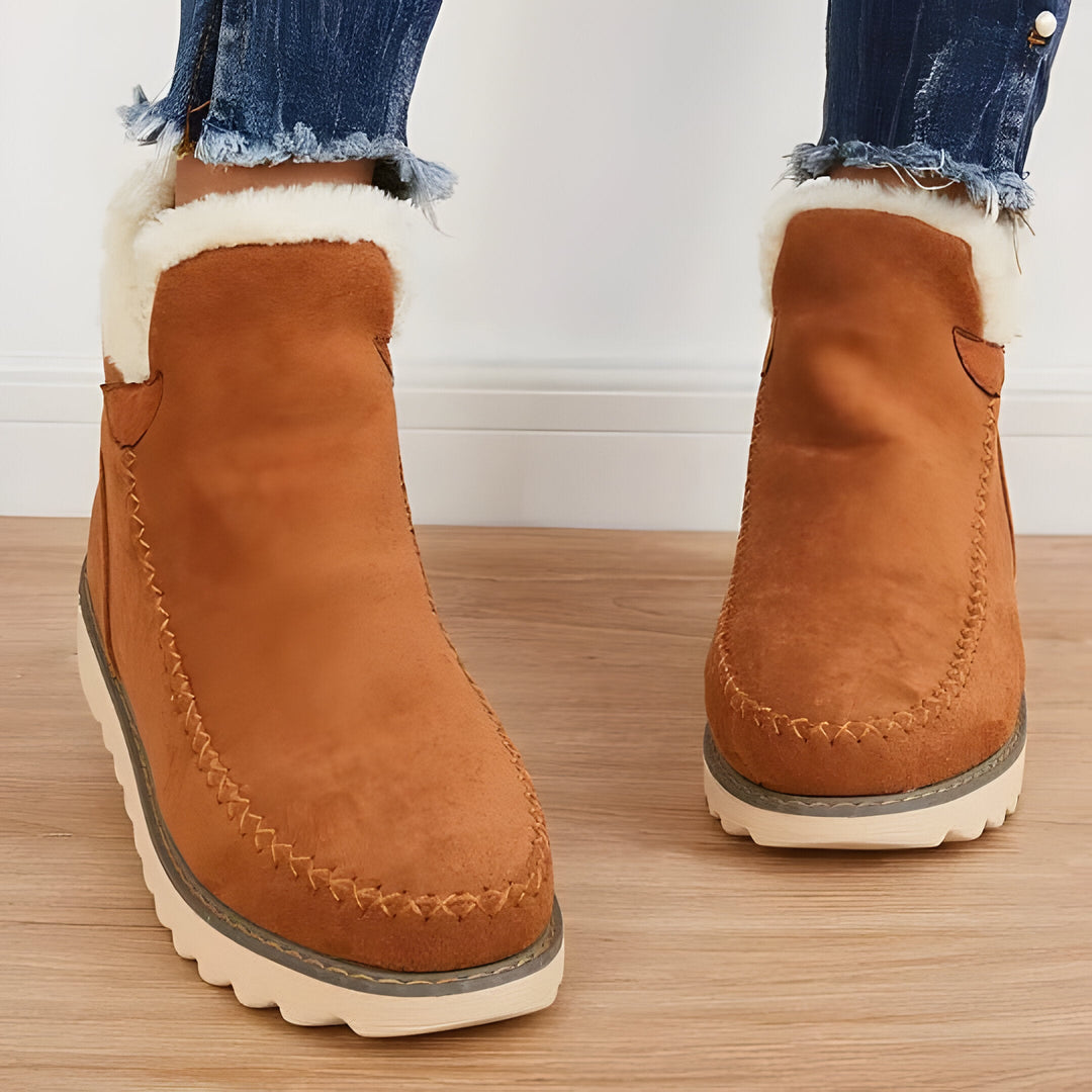Warm & cozy women's slip-on ankle boots for winter, providing comfortable everyday footwear with good support.