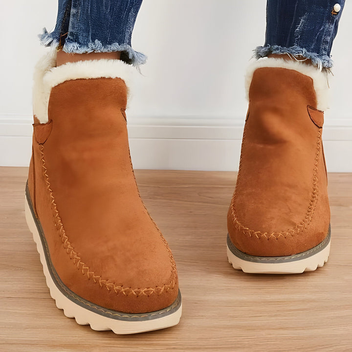 Warm & cozy women's slip-on ankle boots for winter, providing comfortable everyday footwear with good support.
