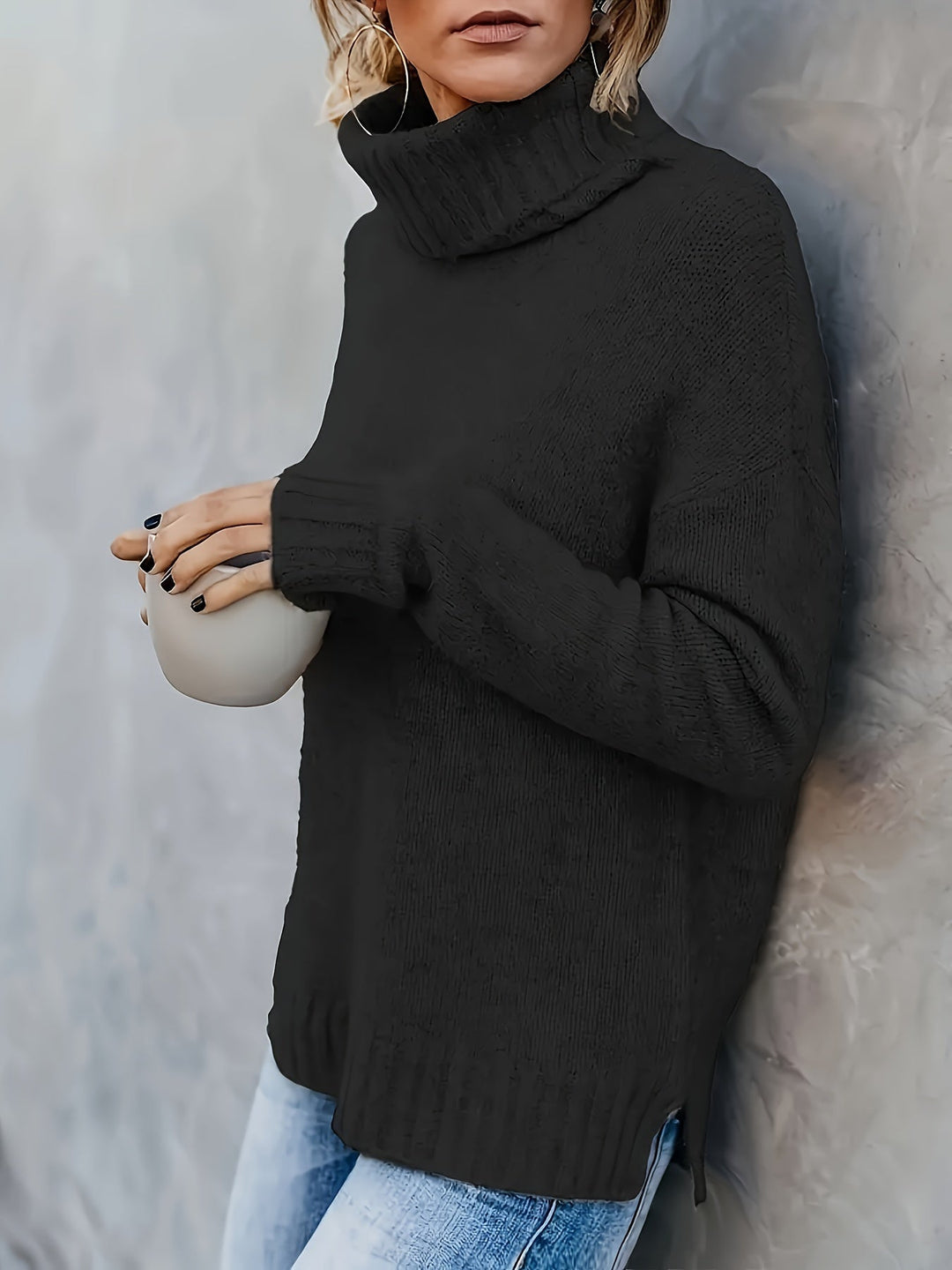 Warm women's turtleneck sweater with stylish split hem, ideal for casual fall fashion.
