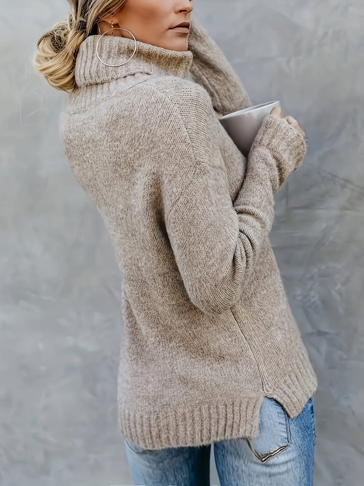 Comfortable women's turtleneck sweater with split hem, relaxed fit, perfect for chilly days.