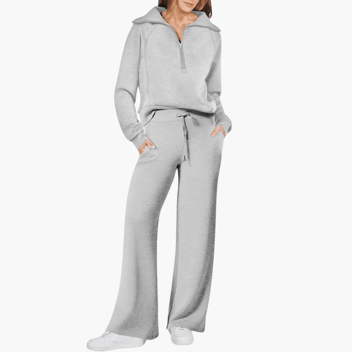 Matching women's relaxed fit zip-up hoodie and wide-leg pants lounge set, ideal for casual and travel comfort.