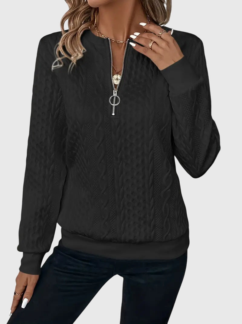 Women's modern cable knit quarter-zip pullover in ivory, sophisticated casual wear.