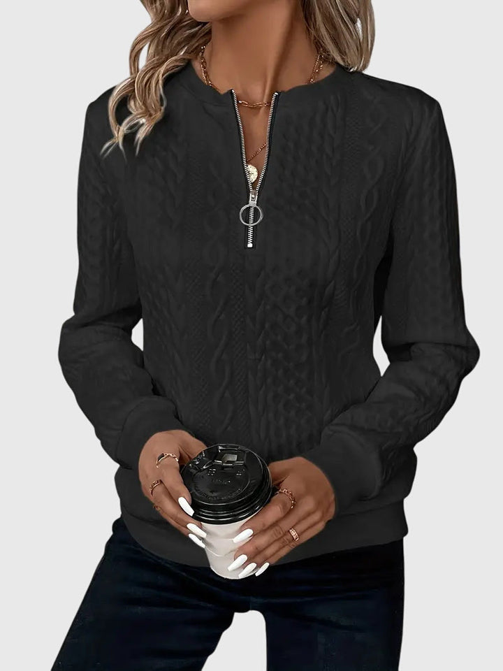 Versatile women's brown cable knit quarter-zip sweater, perfect for chilly evenings.